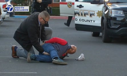 A suspect is arrested by law enforcement personnel after a mass shooting in Half Moon Bay in northern California