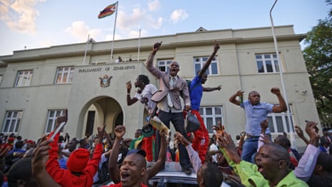 Singing and dancing breaks out on the streets of Harare - video