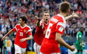Russia’s Artem Dzyuba celebrates scoring their third goal.