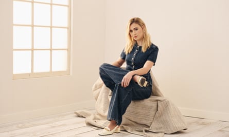 Maria Bakalova sits in a cream-coloured room