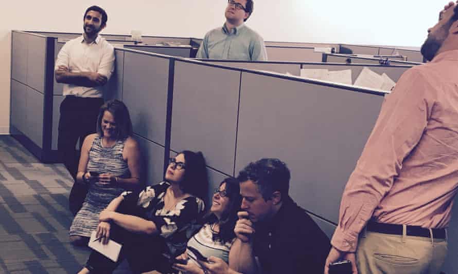 The author, Emily Holden, and her colleagues watch Trump’s Paris agreement speech