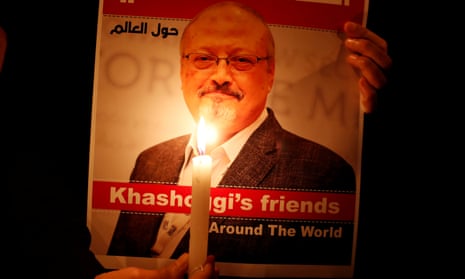 A demonstrator holds a picture of journalist Jamal Khashoggi outside the Saudi consulate in Istanbul.