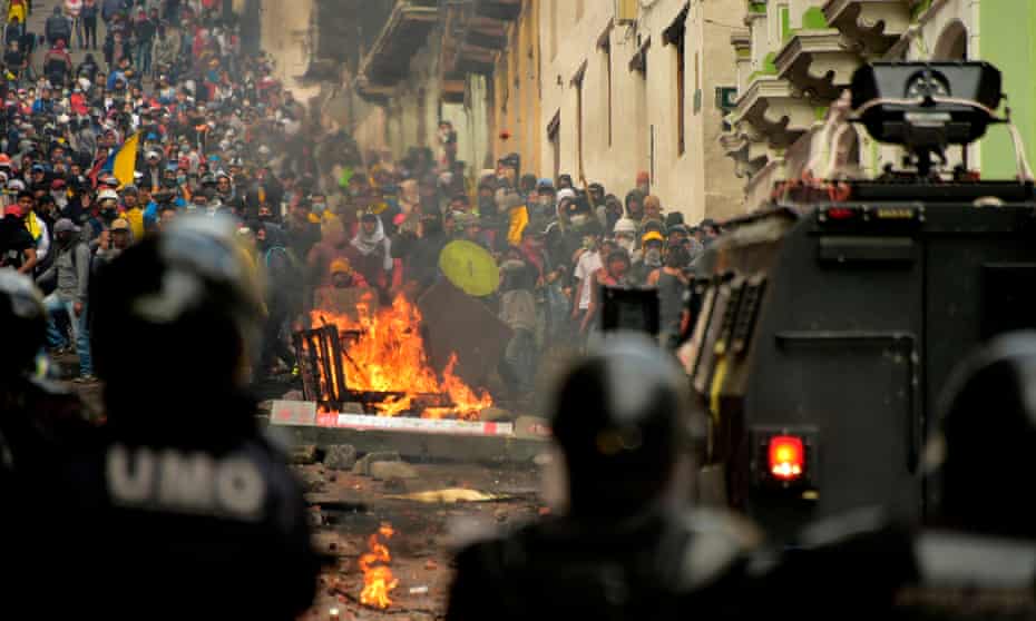 Demonstrators clash with riot police in Quito, Ecuador last week over a fuel price increase ordered by the government to secure an IMF loan.