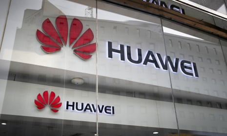 Huawei logos are seen in a shop window in Beijing.