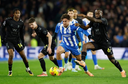 Kostoulas tries to force his way past several Sunderland players
