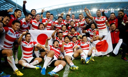 Japan celebrate the 2015 Rugby World Cup pool stage victory over South Africa.