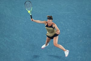 A leaping Elina Svitolina plays a forehand.