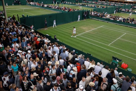 Huge crowds pack the walkways next to Court Six as Harold Mayot of France plays in his match with fellow Frenchman Benjamin Bonzi