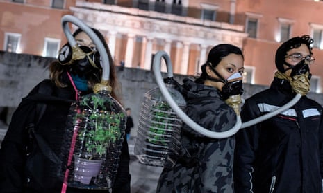 Environmental activists protest in front of the Greek parliament.