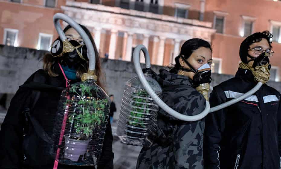 Environmental activists protest in front of the Greek parliament.