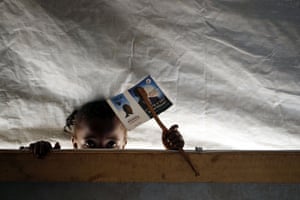 Bangui, Central African Republic: A child peeps into a classroom