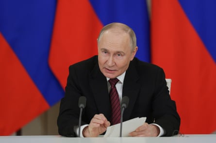 Vladimir Putin makes a statement to the media at the Kremlin in Moscow on 11 May.