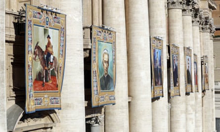 The tapestries of the seven new saints hang from the pillars of Saint Peter’s Basilica.