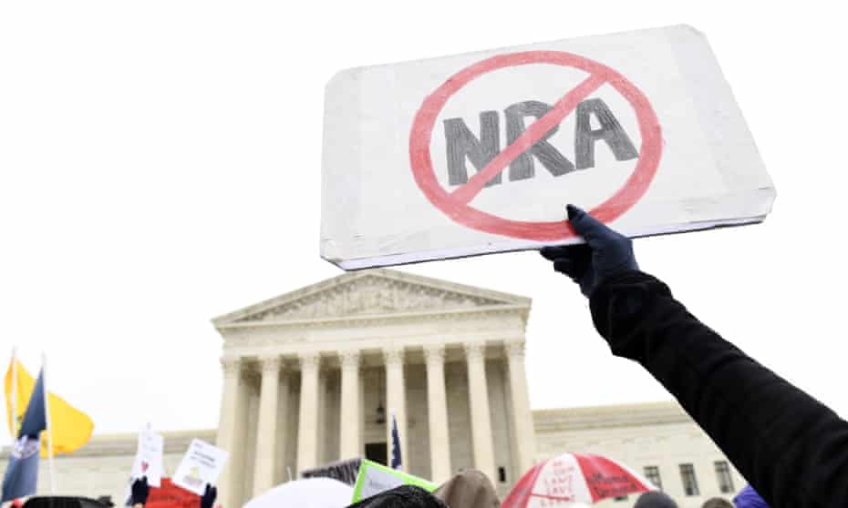 Gun protest,NRAProtesters gather outside the Supreme Court in Washington, Monday, Dec. 2, 2019, during arguments in the first gun rights case before the Supreme Court in nine years. The case was filed by three New York City gun owners who are challenging a ban on carrying a licensed handgun outside city limits to a gun range, shooting competition or second home outside city limits. (AP Photo/Susan Walsh)