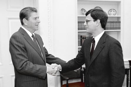 Ronald Reagan shakes the hand of a young man in the Oval Office
