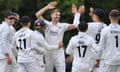 Jimmy Anderson is congratulated by Lancashire teammates after taking his fifth wicket
