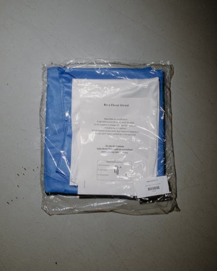 A pack containing blue material and what appears to be instructions on a sheet of paper