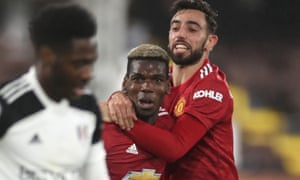 FBL-ENG-PR-FULHAM-MAN UTD<br>Manchester United's French midfielder Paul Pogba (L) celebrates scoring his team's second goal with Manchester United's Portuguese midfielder Bruno Fernandes during the English Premier League football match between Fulham and Manchester United at Craven Cottage in London on January 20, 2021. (Photo by PETER CZIBORRA / POOL / AFP) / RESTRICTED TO EDITORIAL USE. No use with unauthorized audio, video, data, fixture lists, club/league logos or 'live' services. Online in-match use limited to 120 images. An additional 40 images may be used in extra time. No video emulation. Social media in-match use limited to 120 images. An additional 40 images may be used in extra time. No use in betting publications, games or single club/league/player publications. / (Photo by PETER CZIBORRA/POOL/AFP via Getty Images)