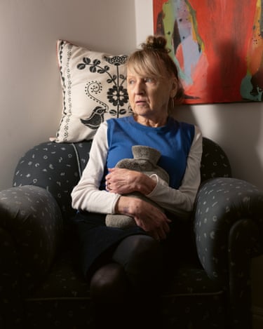 Chris in her favourite armchair with a hot water bottle, 20th October 2024