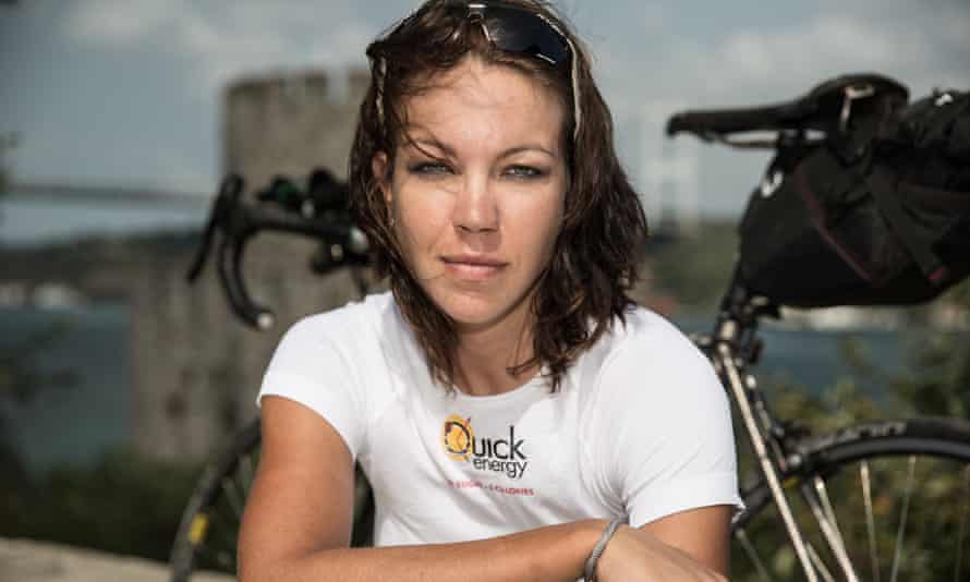 A close-up of Juliana Buhring, her bike behind her.