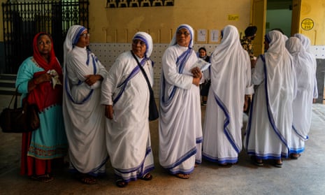 Nuns of the Missionaries of Charity, the order founded by Saint Teresa, stand in queue to cast their votes in Kolkata, India, Saturday, 1 June 2024.