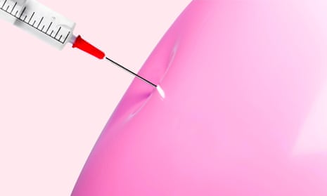 A syringe pressing into the skin of a pink balloon