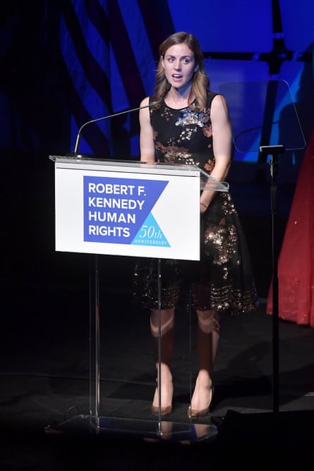 a woman in front of a microphone
