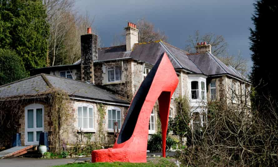 Giant red stiletto shoe at Broomhill Sculpture Garden in Devon