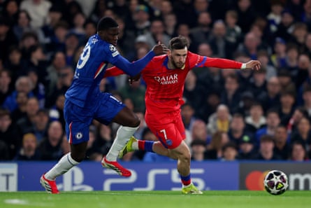 Chelsea’s Mamadou Sarr runs after PSG’s Khvicha Kvaratskhelia.