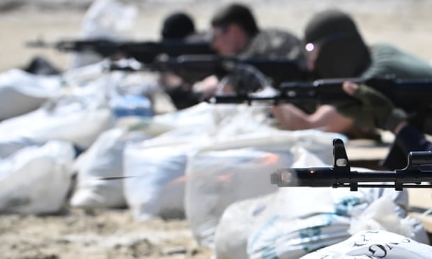 Volunteers undergo weapons’ training outside Lviv, Ukraine. 