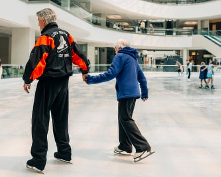 An ice rink in Portland with two people on ice.