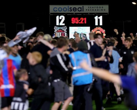 Grimsby fans celebrate their team’s shootout win over Manchester United