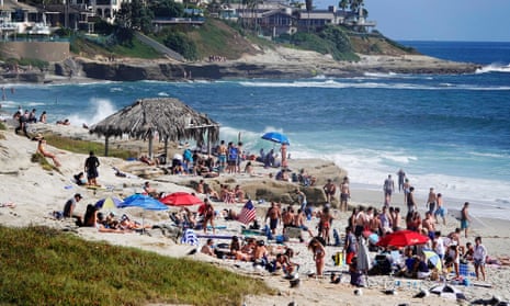 People pack La Jolla beach in California on 3 July. 