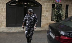 A policeman leaves the Beirut residence of former Nissan chairman Carlos Ghosn on 31 December.