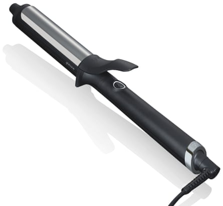 A black and silver ghd Curve Soft Curl Tong on a white background