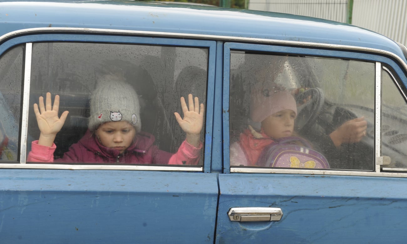 Children arrive by car from Kharkiv at a temporary camp in Belgorod, Russia, last week.