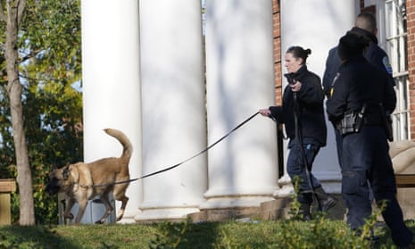 A police canine team searches the scene Monday near where a shooting occurred at the University of Virginia in Charlottesville. 