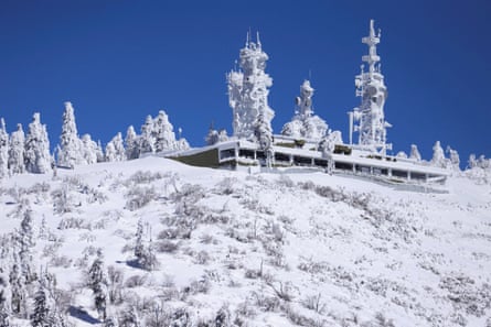 Ice covers communications towers as massive amounts of snow trap residents in mountain towns in San Bernardino county, California.