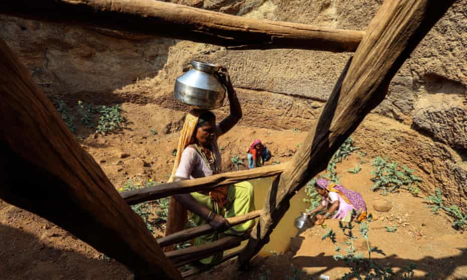 Villagers collect water from an almost dried up well in Mhaismal village in Surgana, western India. The drought is affecting 21 districts in Maharashtra.