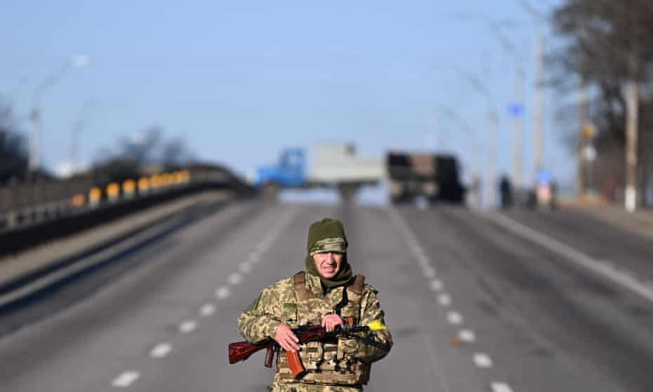 A Ukrainian patrols in the west of Kyiv on Saturday morning, three days into the invasion.