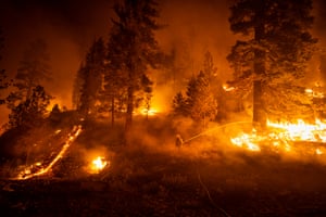 Firefighters battle wildfires in the Lassen National Forest, California in 2021