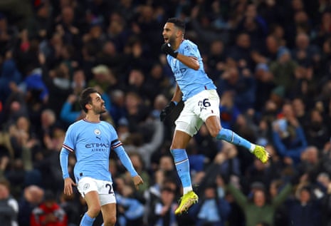 Mahrez celebrates scoring.