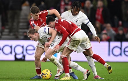 Oliver Skipp fights for the ball against Nottingham Forest