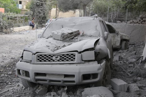 A wrecked car is seen on 26 April after an Israeli strike on buildings and vehicles in southern Lebanon.