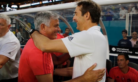 Real Madrid coach Julen Lopetegui, right, greets Manchester United coach Jose Mourinho.