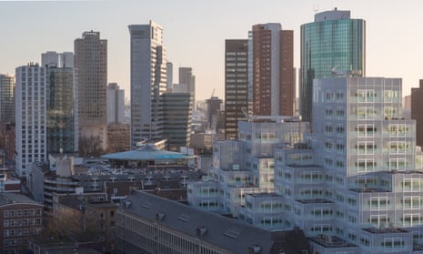 Sim City stack … The Timmerhuis by OMA rises on to Rotterdam’s skyline like a pixelated mountain.