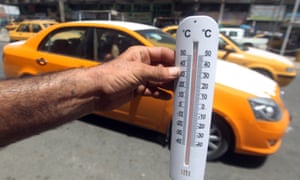 A man shows a thermometer reading more than fifty degrees Celsius on 30 July 30, 2015 in the capital Baghdad.