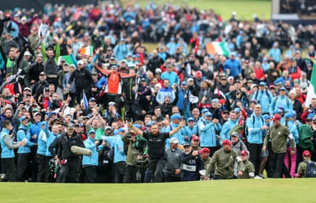 Shane Lowry emerges from the gallery on the 18th as he walks up the fairway holding a five-shot lead at the 2019 Open.