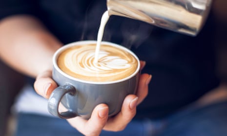 Close-Up Of Barista Holding Coffee Cup