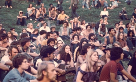 People watch a performance at the Woodstock Music and Arts Fair, in Bethel, New York, in August 1969.
